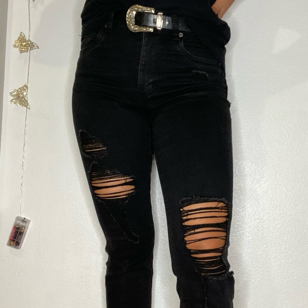 Semi- washed black ripped jeans